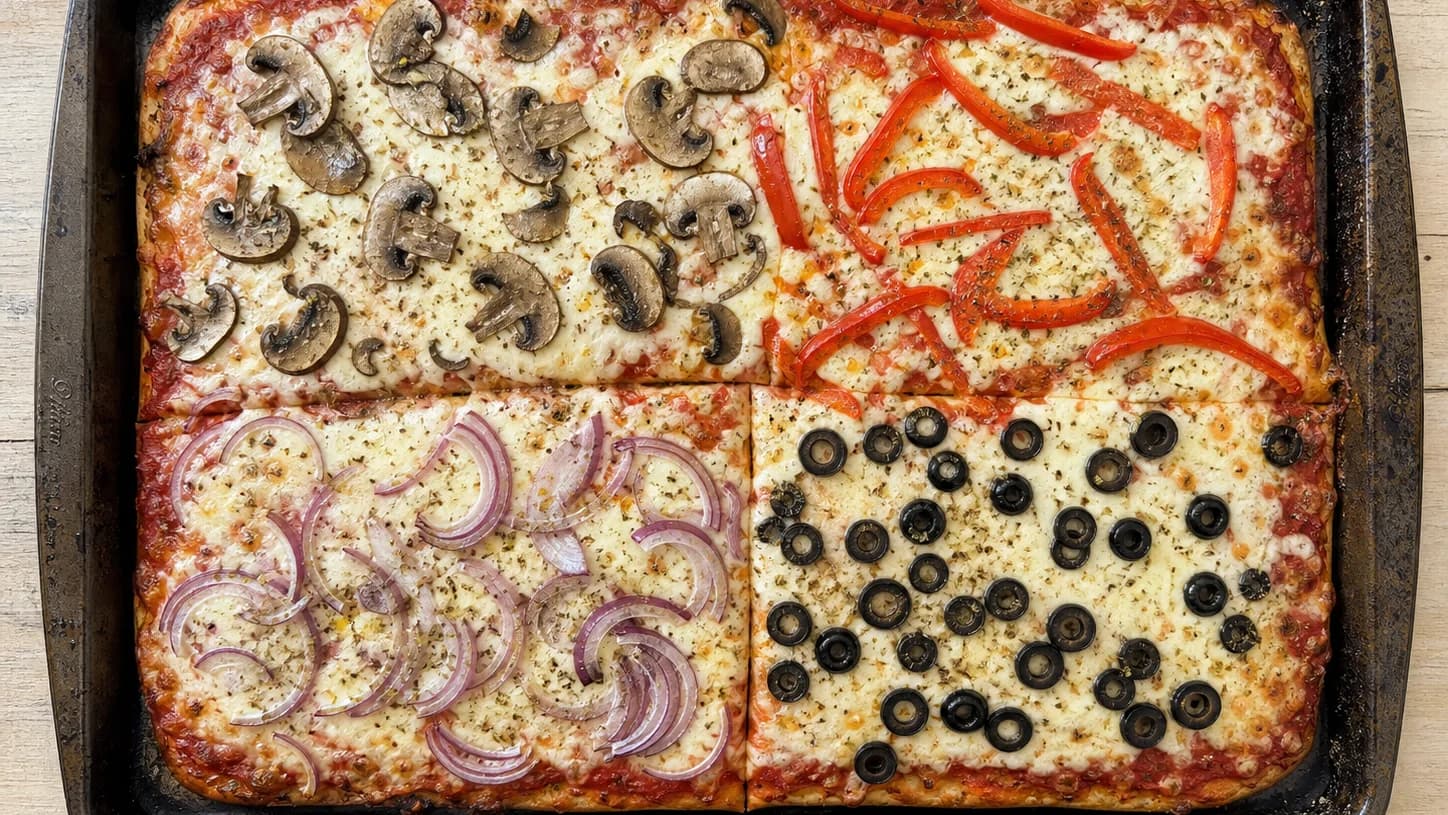 Overhead view of build-your-own sheet-pan pizza, served as a family dinner.