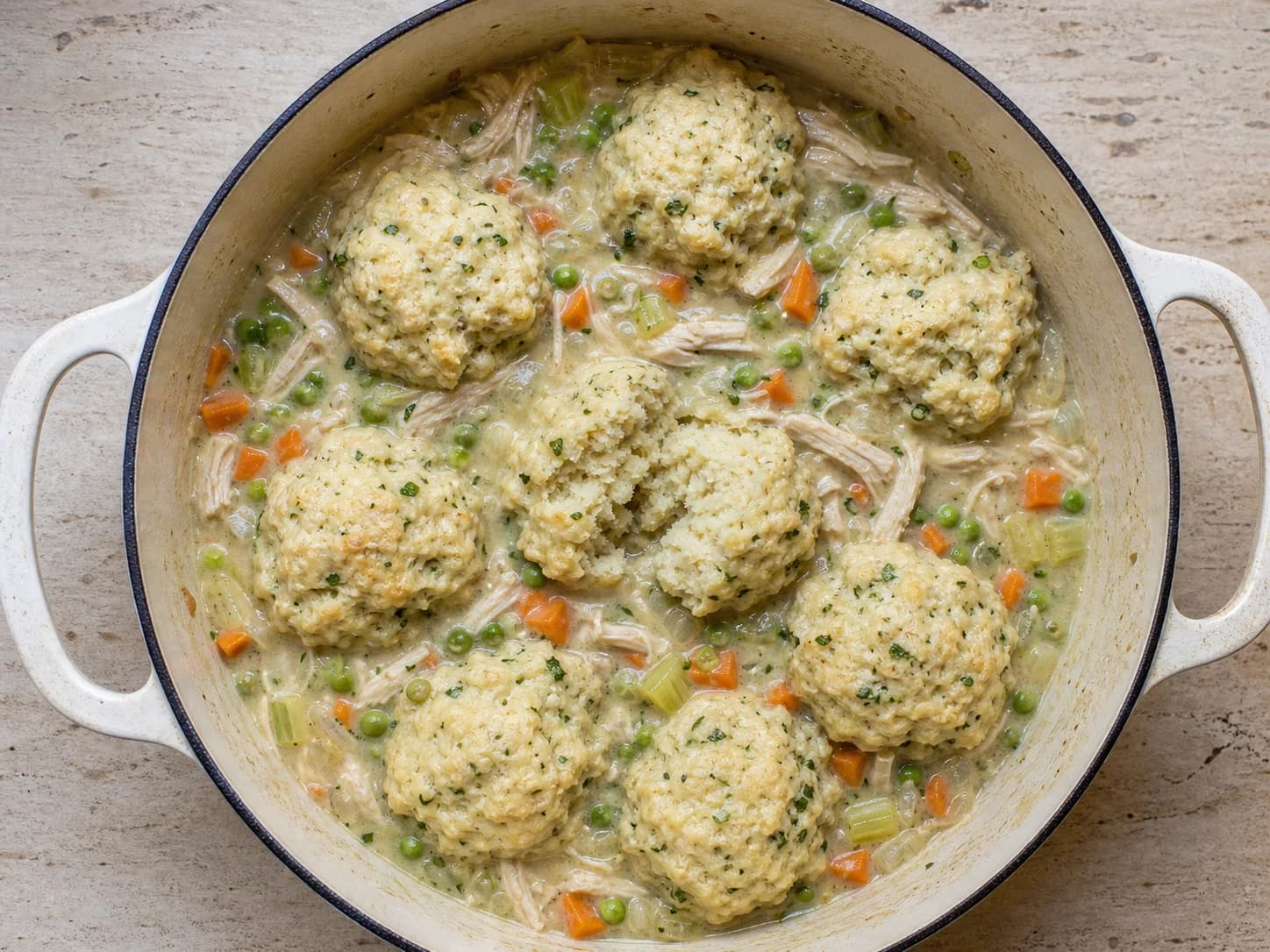 Overhead view of chicken & dumpling stew, served as a family dinner.